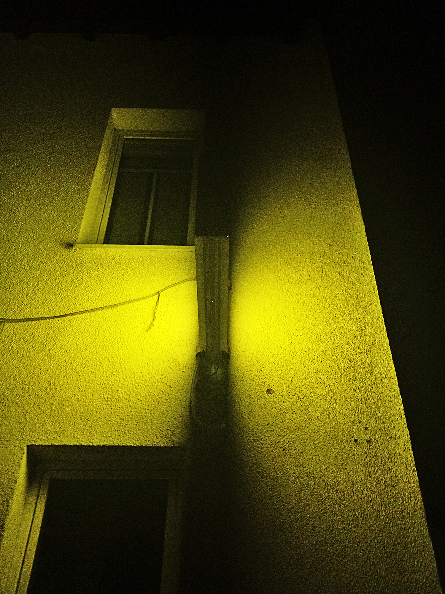 Shadow play from a neon sign, Ilmenau, Germany